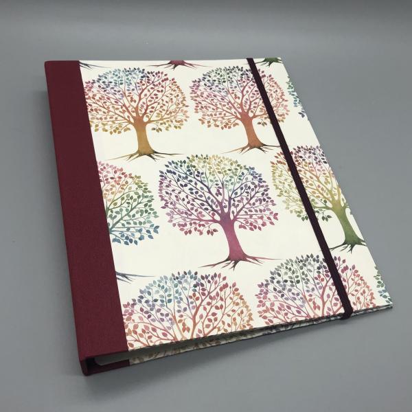 Buch Ringmechanik Baummotiv rot bunt